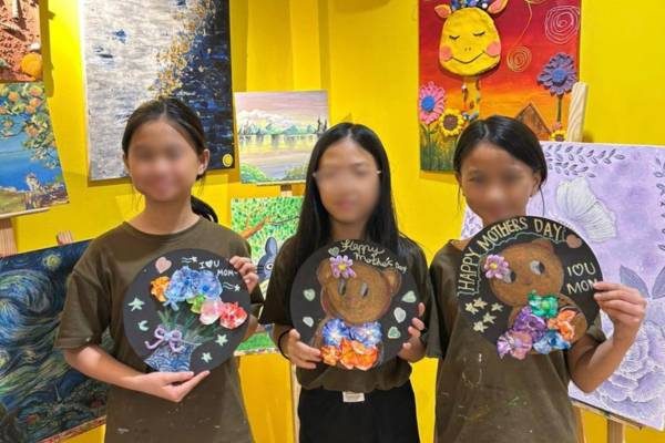 Students with their seasonal crafts